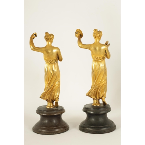 513 - A PAIR OF 19TH CENTURY FIGURAL GILT BRONZE SCULPTURES modelled as classical maidens playing symbols ... 