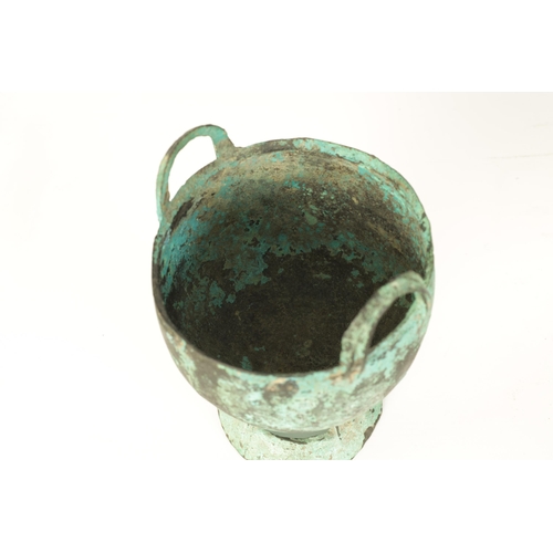 515 - AN ANCIENT PATINATED BRONZE TWO HANDLED VESSEL - POSSIBLY ROMAN with ring handles and openwork flare... 