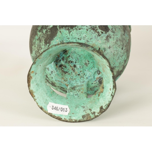 515 - AN ANCIENT PATINATED BRONZE TWO HANDLED VESSEL - POSSIBLY ROMAN with ring handles and openwork flare... 