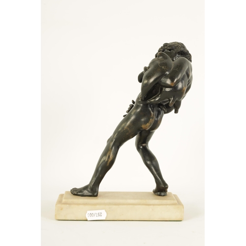 516 - AN EARLY 20TH CENTURY GRAND TOUR BRONZE OF BACCHUS mounted on a moulded white marble plinth base. (2... 