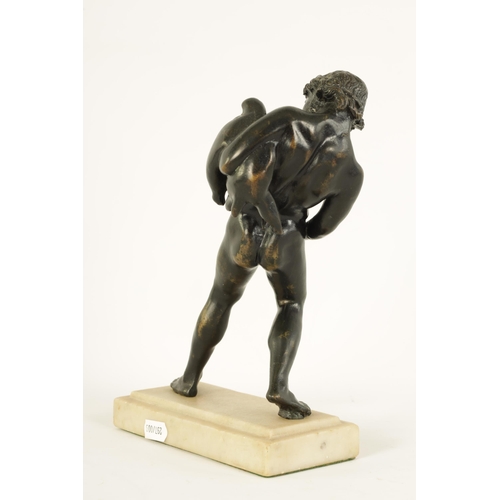 516 - AN EARLY 20TH CENTURY GRAND TOUR BRONZE OF BACCHUS mounted on a moulded white marble plinth base. (2... 