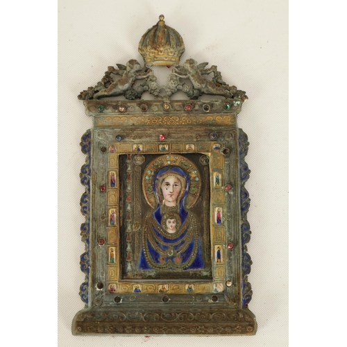 517 - AN EARLY SILVER AND ENAMEL RELIGIOUS PLAQUE DEPICITING THE VIRGIN MOTHER AND CHILD finely worked wit... 