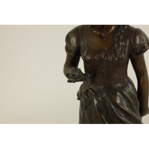 519 - ARNOLDT KUNNE (1866 1942) AN EARLY 20TH CENTURY GERMAN BRONZE SCULTURE modelled as a girl holding a ... 