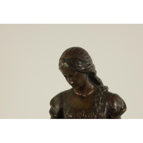 519 - ARNOLDT KUNNE (1866 1942) AN EARLY 20TH CENTURY GERMAN BRONZE SCULTURE modelled as a girl holding a ... 