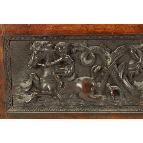 522 - A 19TH CENTURY FRAMED CONTINENTAL CARVED WALNUT PANEL finely carved in high relief with sea serpents... 