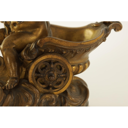 523 - A 19TH CENTURY FRENCH GILT BRONZE SCULPTURE depicting a winged cherub and chariot being drawn by a b... 