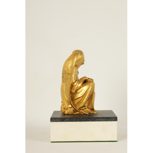 530 - A LATE 19TH CENTURY FRENCH GILT BRONZE SCULPTURE depicting a crouching winged angel, mounted on a la... 