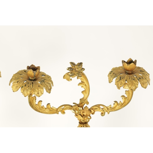 532 - A PAIR OF 19TH CENTURY TWO BRANCH ORMOLU AND OPAQUE GLASS CANDELABRA with leaf cast branchwork arms ... 