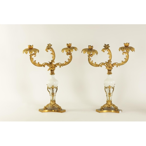 532 - A PAIR OF 19TH CENTURY TWO BRANCH ORMOLU AND OPAQUE GLASS CANDELABRA with leaf cast branchwork arms ... 