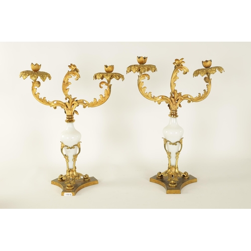 532 - A PAIR OF 19TH CENTURY TWO BRANCH ORMOLU AND OPAQUE GLASS CANDELABRA with leaf cast branchwork arms ... 