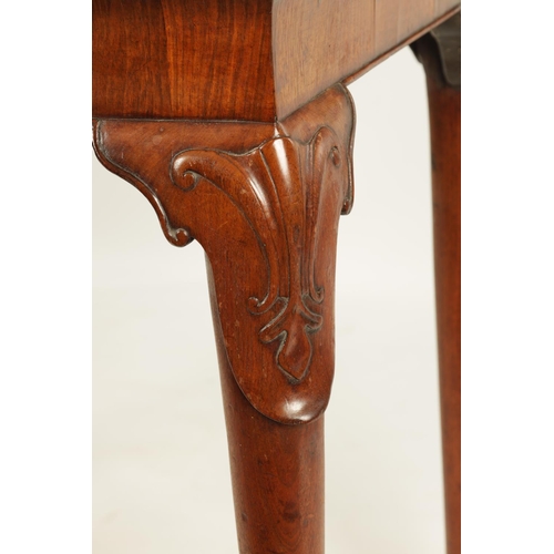 1002 - A GEORGE II WALNUT CONSOLE TABLE the veined Carrera marble top above a rounded short-grained freize ... 