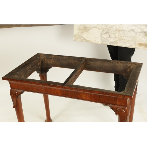 1002 - A GEORGE II WALNUT CONSOLE TABLE the veined Carrera marble top above a rounded short-grained freize ... 