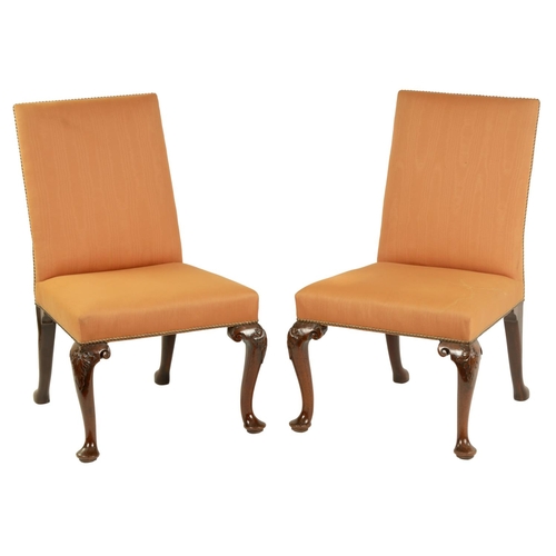 1004 - A PAIR OF GEORGE II MAHOGANY UPHOLSTERED SIDE CHAIRS with rectangular covered backs and seats, raise... 