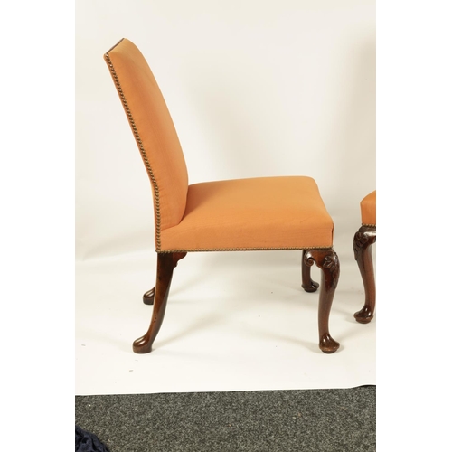 1004 - A PAIR OF GEORGE II MAHOGANY UPHOLSTERED SIDE CHAIRS with rectangular covered backs and seats, raise... 