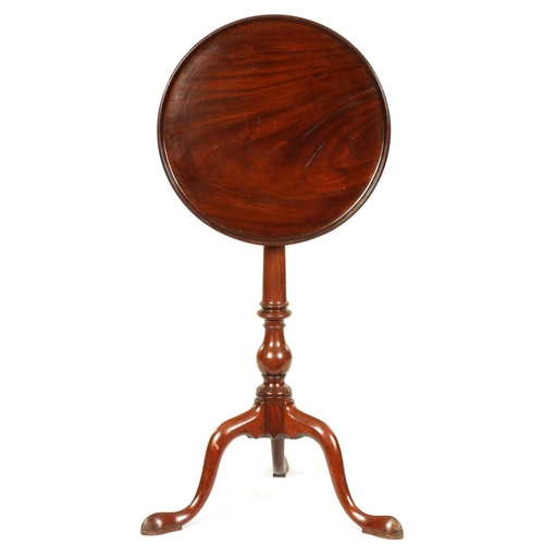 991 - A GEORGE III MAHOGANY TILT-TOP WINE TABLE with dished moulded top above a bulbous ring turned stem s... 