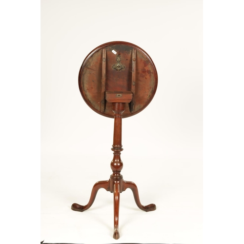 991 - A GEORGE III MAHOGANY TILT-TOP WINE TABLE with dished moulded top above a bulbous ring turned stem s... 