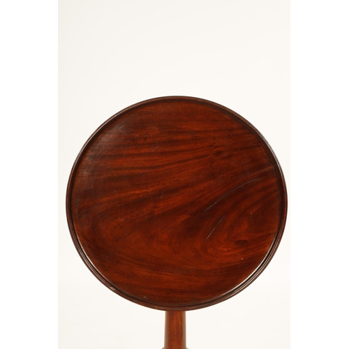 991 - A GEORGE III MAHOGANY TILT-TOP WINE TABLE with dished moulded top above a bulbous ring turned stem s... 