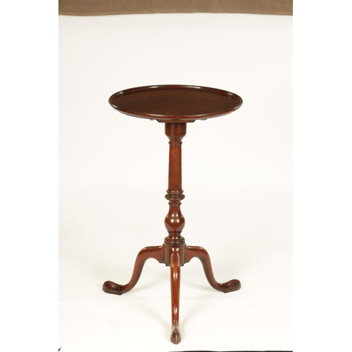 991 - A GEORGE III MAHOGANY TILT-TOP WINE TABLE with dished moulded top above a bulbous ring turned stem s... 