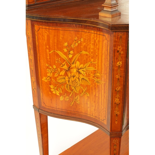 995 - EDWARDS AND ROBERTS. A FINE EDWARDIAN INLAID SATINWOOD SERPENTINE SHAPED DISPLAY CABINET with swan-n... 