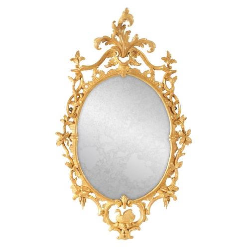 996 - A FINE MID 18TH CENTURY OVAL CARVED GILT GESSO HANGING MIRROR IN THE MANNER OF THOMAS CHIPPENDALE of... 