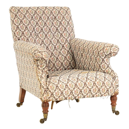 997 - HOWARD AND SONS. A 19TH CENTURY WALNUT FRAMED UPHOLSTERED ARMCHAIR with butttoned back and raised ar... 