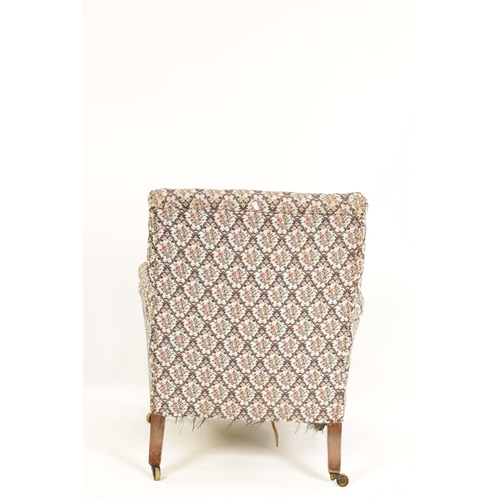 997 - HOWARD AND SONS. A 19TH CENTURY WALNUT FRAMED UPHOLSTERED ARMCHAIR with butttoned back and raised ar... 