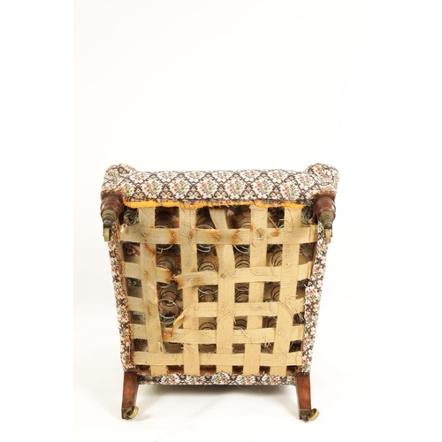 997 - HOWARD AND SONS. A 19TH CENTURY WALNUT FRAMED UPHOLSTERED ARMCHAIR with butttoned back and raised ar... 