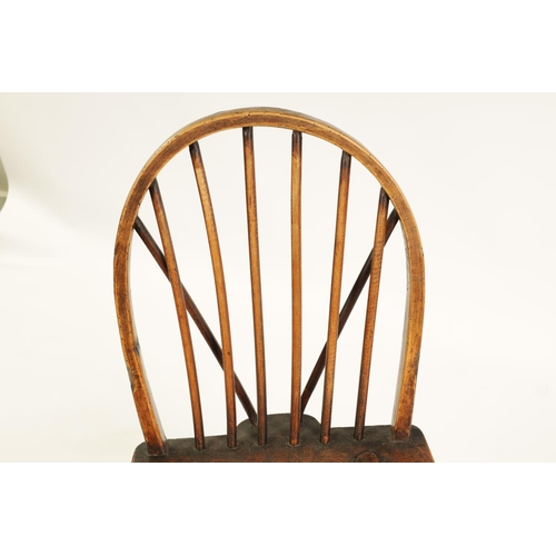 999 - AN 18TH CENTURY PRIMITIVE ASH AND ELM STICK BACK CHILD'S CHAIR with hooped stick back and splayed le... 