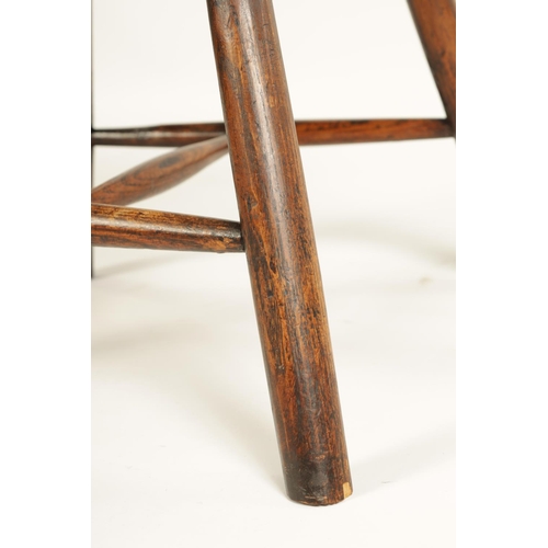 999 - AN 18TH CENTURY PRIMITIVE ASH AND ELM STICK BACK CHILD'S CHAIR with hooped stick back and splayed le... 