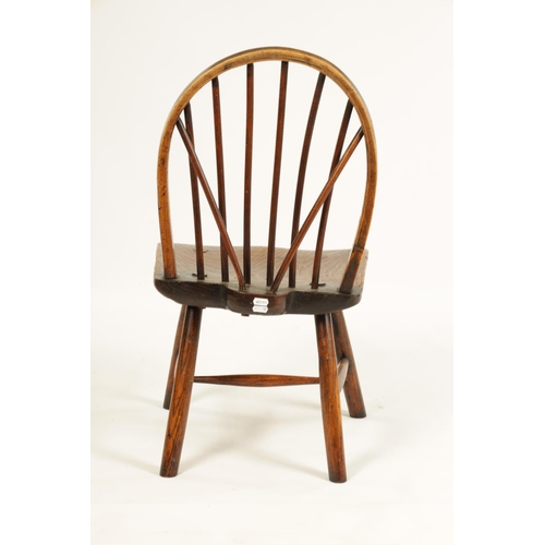 999 - AN 18TH CENTURY PRIMITIVE ASH AND ELM STICK BACK CHILD'S CHAIR with hooped stick back and splayed le... 