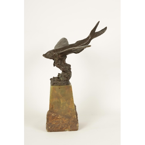 536 - AN UNUSUAL LATE 19TH CENTURY BRONZE SCULPTURE OF A FLYING FISH mounted on a tapering green onyx plin... 