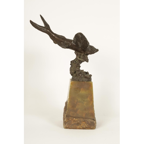 536 - AN UNUSUAL LATE 19TH CENTURY BRONZE SCULPTURE OF A FLYING FISH mounted on a tapering green onyx plin... 