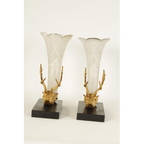 545 - A PAIR OF 19TH CENTURY GILT BRONZE STAGS-HEAD AND CORNUCOPIA CUT GLASS VASES mounted on black slate ... 