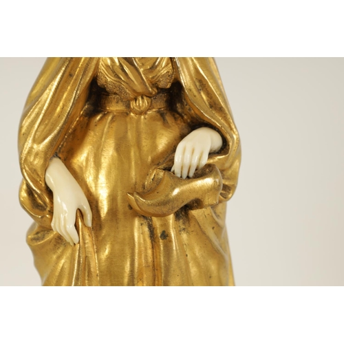 551 - E BERNOUD AN ART NOUVEAU FRENCH GILT BRONZE AND IVORY FIGURAL BRONZE depiciting a Dutch girl wearing... 