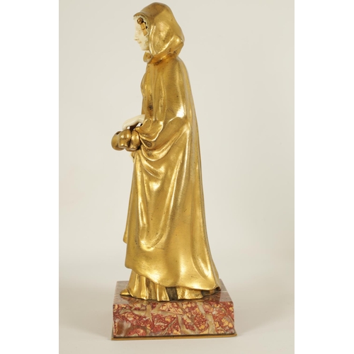 551 - E BERNOUD AN ART NOUVEAU FRENCH GILT BRONZE AND IVORY FIGURAL BRONZE depiciting a Dutch girl wearing... 