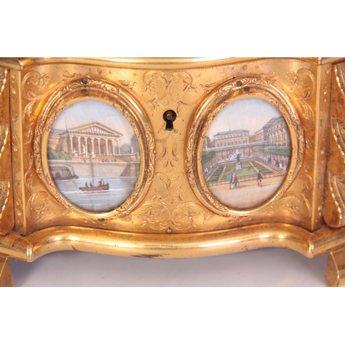 556 - A FINE 19TH CENTURY FRENCH ORMOLU ENGRAVED SERPENTINE SHAPED TABLE CASKET set with oval painted pane... 