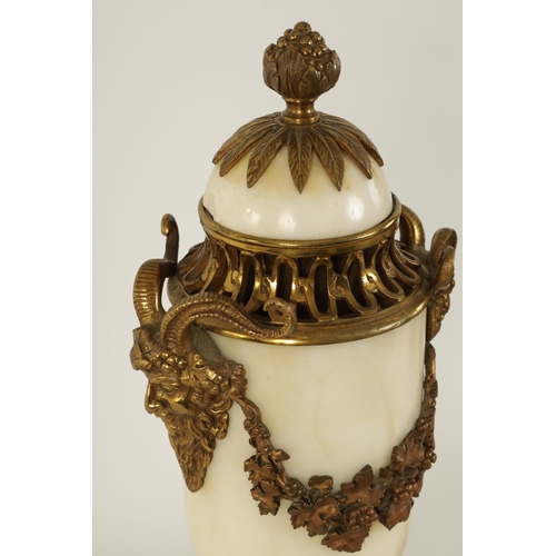 562 - A PAIR OF 19TH CENTURY CARRARA MARBLE AND ORMOLU MOUNTED CASOLETTES with detachable finials, peirced... 