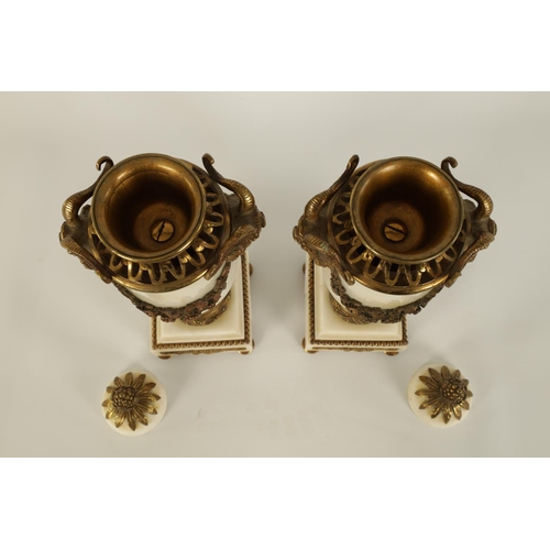 562 - A PAIR OF 19TH CENTURY CARRARA MARBLE AND ORMOLU MOUNTED CASOLETTES with detachable finials, peirced... 