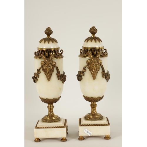 562 - A PAIR OF 19TH CENTURY CARRARA MARBLE AND ORMOLU MOUNTED CASOLETTES with detachable finials, peirced... 