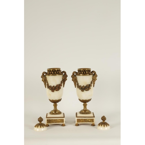 562 - A PAIR OF 19TH CENTURY CARRARA MARBLE AND ORMOLU MOUNTED CASOLETTES with detachable finials, peirced... 