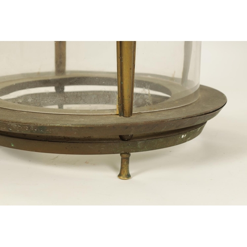 566 - AN UNUSUAL 19TH CENTURY BRASS CIRCULAR HANGING LANTERN of cylindrical glazed panelled form beneath s... 