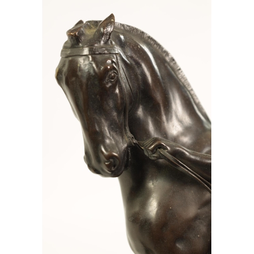 569 - RUDOLPH KAESBACH (1873 - 1950) AN EARLY 20TH CENTURY PATINATED BRONZE SCULPTURE OF A MAN AND HORSE m... 