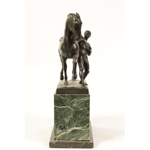 569 - RUDOLPH KAESBACH (1873 - 1950) AN EARLY 20TH CENTURY PATINATED BRONZE SCULPTURE OF A MAN AND HORSE m... 