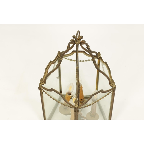 572 - A GOOD 19TH CENTURY GILT BRASS FIVE SIDED HANGING LANTERN with swagged decoration and pineapple fini... 