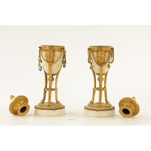 573 - A PAIR OF 19TH CENTURY ADAM STYLE ORMOLU MOUNTED WHITE MARBLE REVERSIBLE URNS/CANDLESTICKS the domed... 