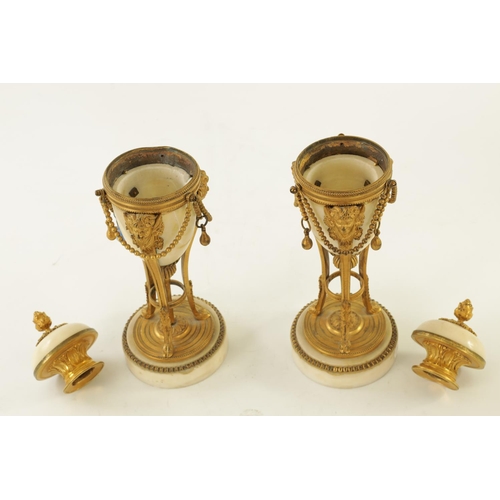 573 - A PAIR OF 19TH CENTURY ADAM STYLE ORMOLU MOUNTED WHITE MARBLE REVERSIBLE URNS/CANDLESTICKS the domed... 