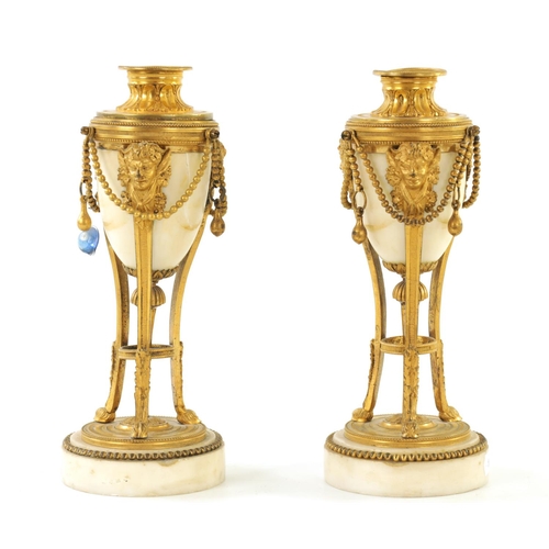 573 - A PAIR OF 19TH CENTURY ADAM STYLE ORMOLU MOUNTED WHITE MARBLE REVERSIBLE URNS/CANDLESTICKS the domed... 