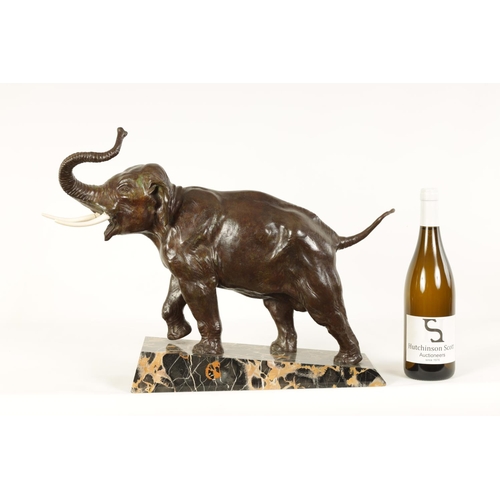 578 - A FRENCH ART DECO BRONZE SCULPTURE OF AN ELEPHANT mounted on a angled back marble base - stamped Bro... 