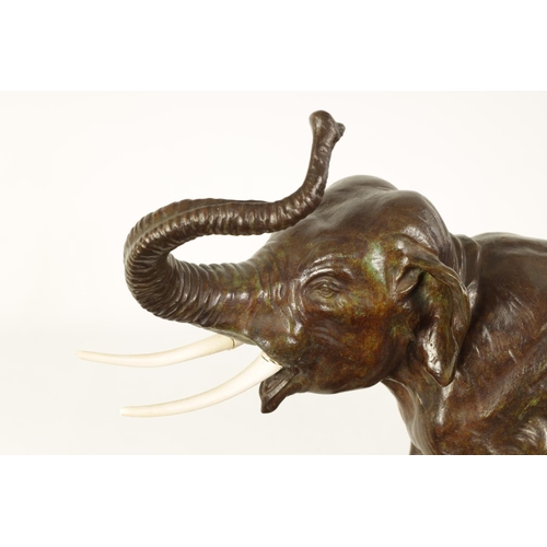 578 - A FRENCH ART DECO BRONZE SCULPTURE OF AN ELEPHANT mounted on a angled back marble base - stamped Bro... 