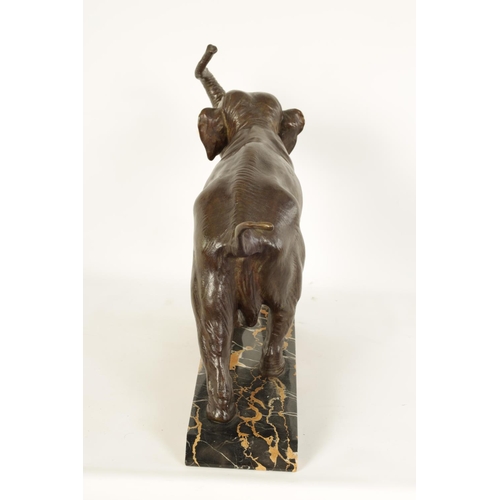 578 - A FRENCH ART DECO BRONZE SCULPTURE OF AN ELEPHANT mounted on a angled back marble base - stamped Bro... 